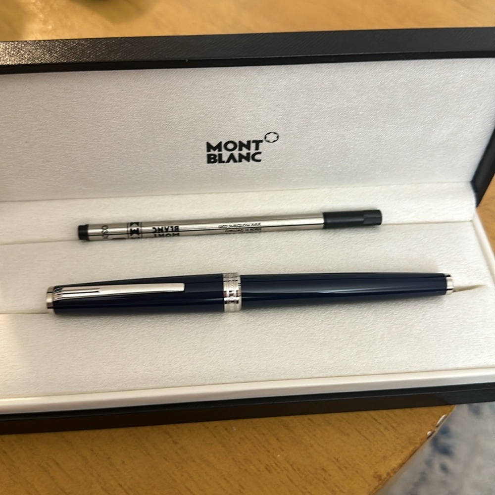 Brand new never used Mont Blanc navy and silver pen. With case and packaging